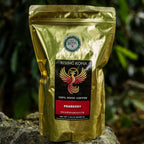 Gold coffee bag with branding on a rock in a natural setting